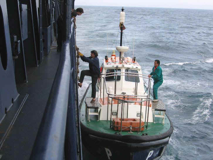 Pilot boarding a ship from a pilot boat, prior to entering a harbour (Image credits : Danny Cornelissen)