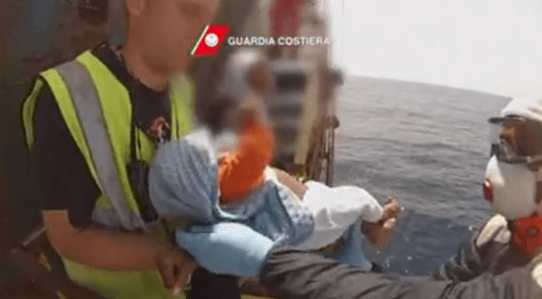 Video: Baby Rescued From Immigrant Ship By Italian Coast Guard
