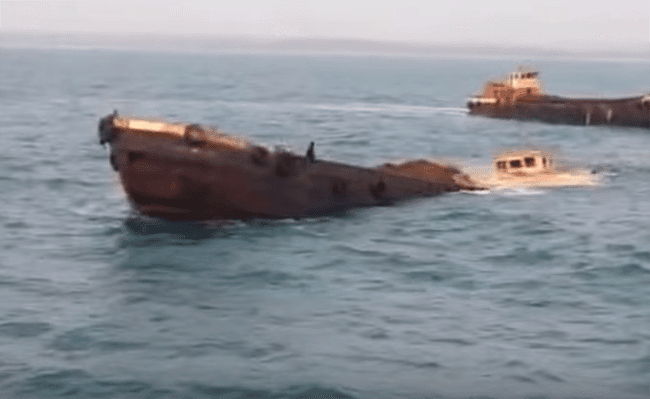 Watch: Raw Video Of Loaded Barge Sinking