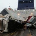Toppled trucks and crushed van on deck