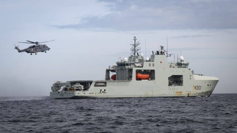 Cyclone from 12 Wing Shearwater flies off the stern of HMCS HARRY DEWOLF during Phase 4 Shipboard Helicopter Operating Limits off the coast of Nova Scotia on June 3, 2021.