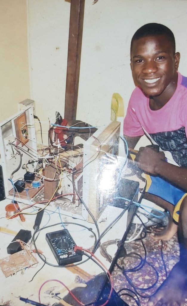 Gafar Olatunde working with electronics