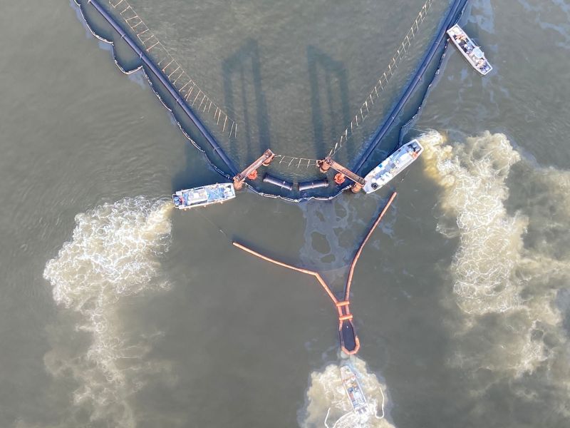 Two response vessels towing a Current Buster hold position at an apex of the EPB to collect oil on Monday. The barrier was designed in a diamond shape in order to channel any oil at the surface toward an apex during a flooding or ebbing tide.