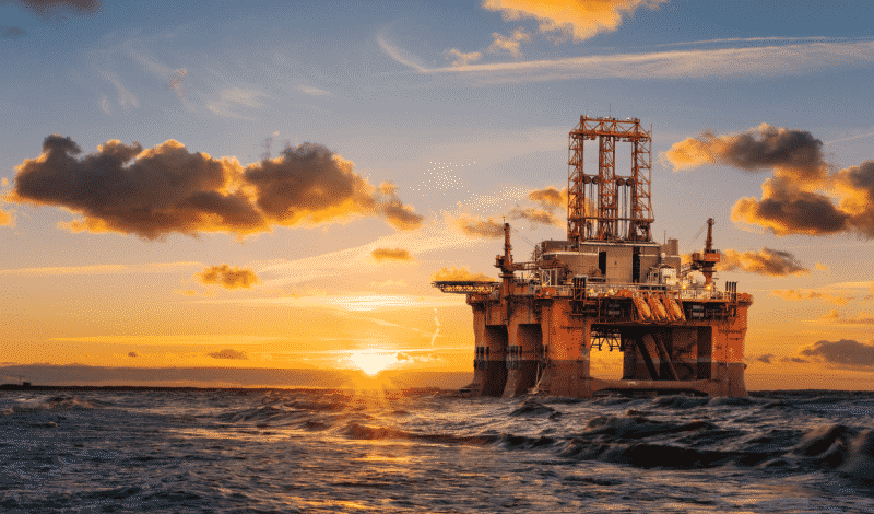 View of an oil rig during sunset