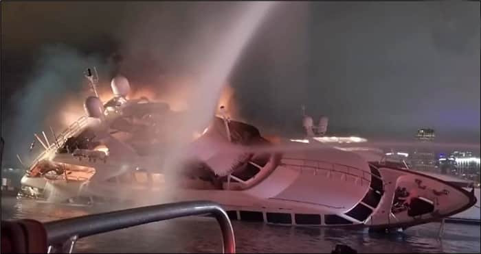 yacht-Andiamo-is-seen-ablaze-and-listing-to-starboard-as-fireboats-attempt-to-extinguish-the-fire.-Photo-courtesy-of-Miami-Dade-Fire-Rescue