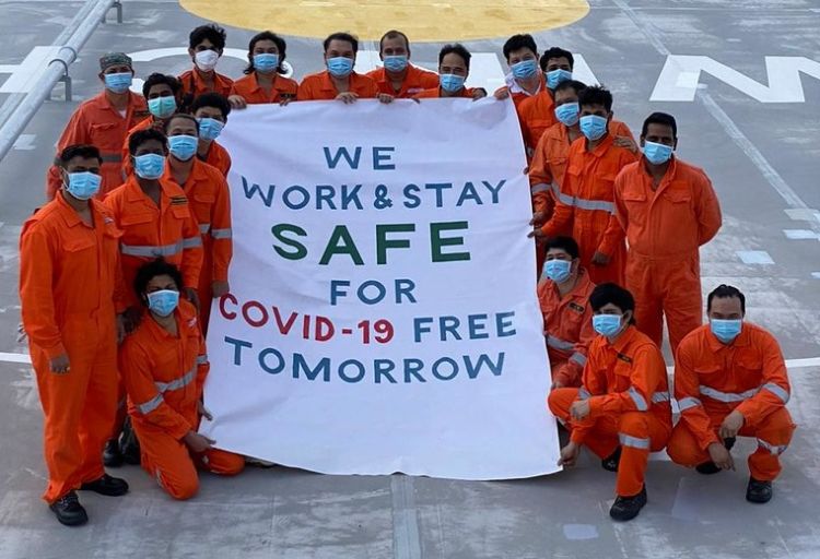 Seafarers on board vessel sharing a message of safety. Photo credit - Mitsui O.S.K. Lines, Ltd
