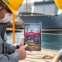 DSME employees are working by comparing a real ship with a virtual ship implemented with a Mixed Reality (MR) system