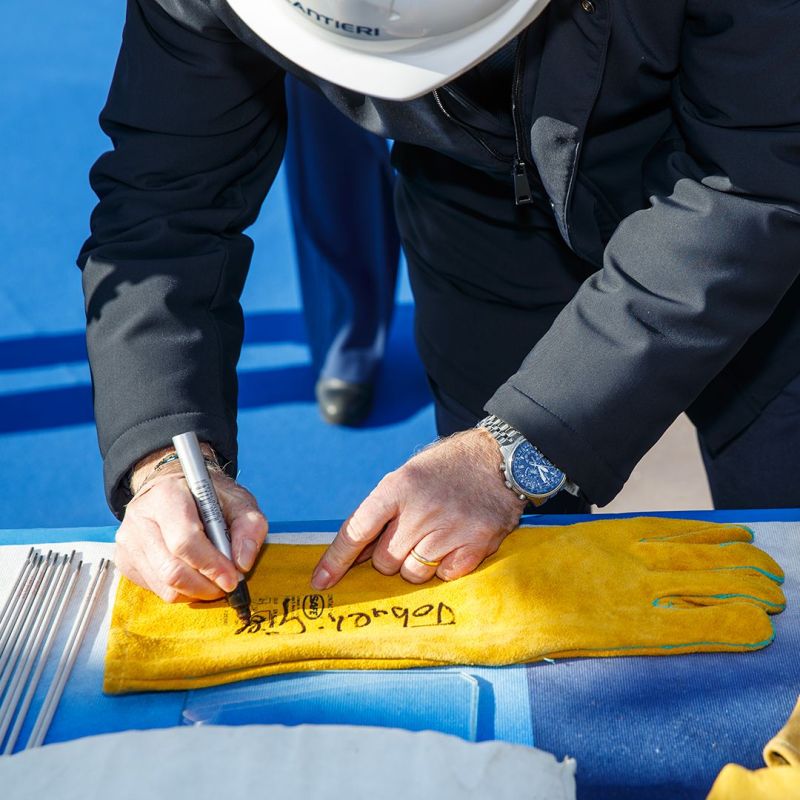signing the ceremonial glove