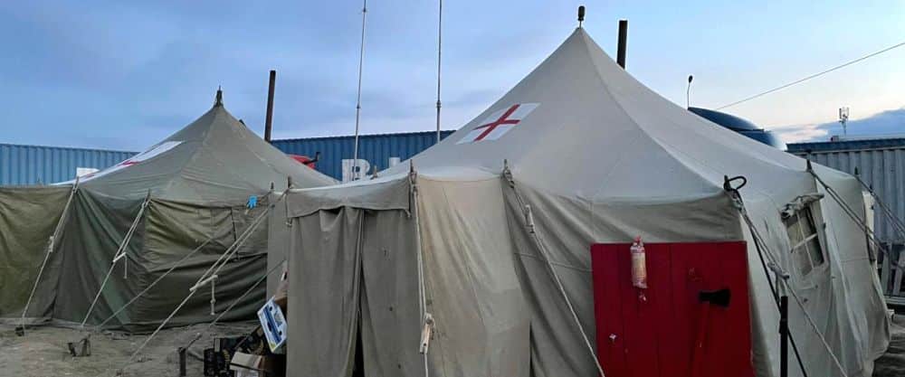 tent with a red cross on it