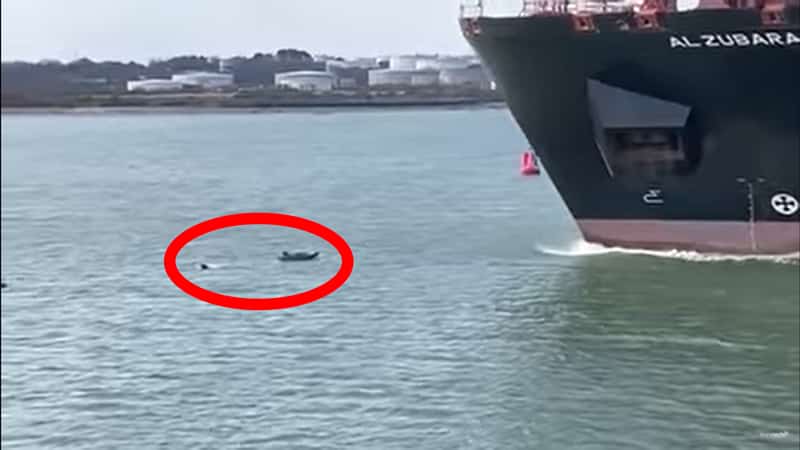 man swimming away from ship