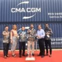 CMA CGM execs in front of its containres